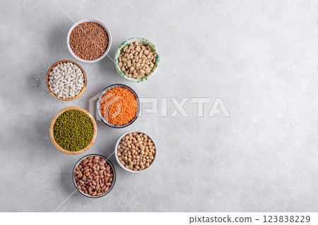 Healthy legumes assortment in the bowls on gray background, top view, copy space Healthy legumes assortment in the bowls on gray background, top view, copy space 123838229