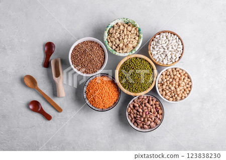 Healthy variety of dried legumes in gray background, top view 123838230