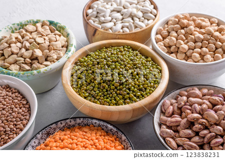 Healthy variety of dried legumes in kitchen table, close up Healthy variety of dried legumes in kitchen table, close up 123838231