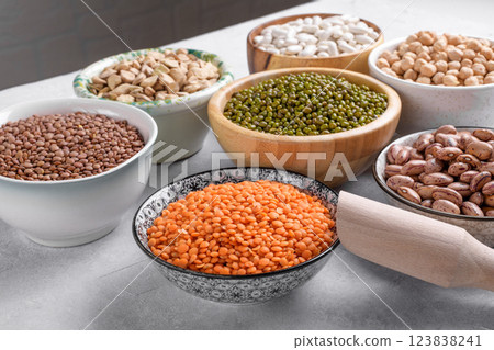 Mixed pulses for healthy and balanced diet in the bowls on the table 123838241