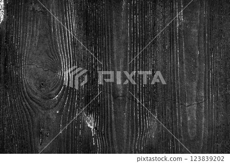 Dark concrete wall with deep wood grain texture. Rugged aged textured black surface. Monochrome dramatic abstract background Dark concrete wall with deep wood grain texture. Rugged aged textured black surface. Monochrome dramatic abstract background 123839202