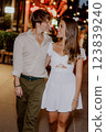 Enjoying a Romantic Evening Stroll in Comfortable and Casual Attire Under the Stars 123839240