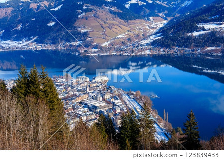 Small Village Near a Mountain Lake Surrounded by Snow-capped Mountains 123839433