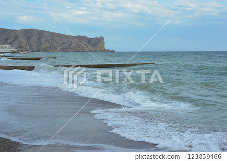 Background landscape view of Sudak Bay, the city of Sudak and its embankment in Crimea. 123839466