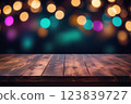 Festive dark background with colorful bokeh and empty wooden stage. 123839727