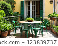 Beautiful view with tables and chairs at a open terrace cafe in italian village, Italy. Sun light 123839737