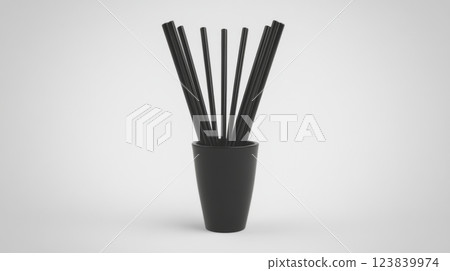 Black chopsticks arranged in a minimalist vase on a simple background 123839974