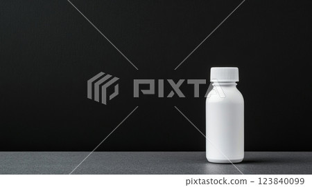 Minimalist bottle on a dark surface in a modern setting 123840099