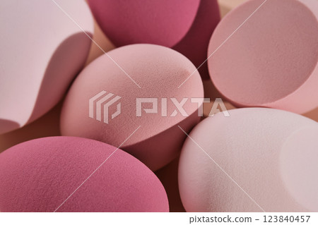 A set of makeup sponges on a pink background. A set of makeup sponges on a pink background. 123840457