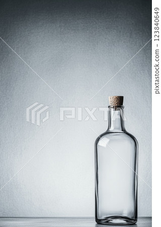 Transparent bottle with cork stopper 123840649