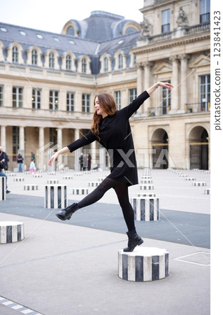 An Elegant Woman Skills in Balancing Gracefully on Distinct Architectural Features and Styles An Elegant Woman Skills in Balancing Gracefully on Distinct Architectural Features and Styles 123841423