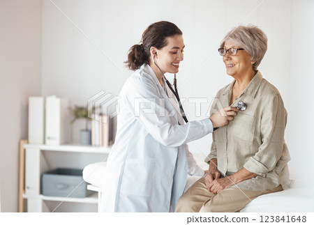 patient with a doctor in medical office patient with a doctor in medical office 123841648
