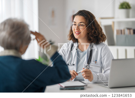 patient with a doctor in medical office patient with a doctor in medical office 123841653