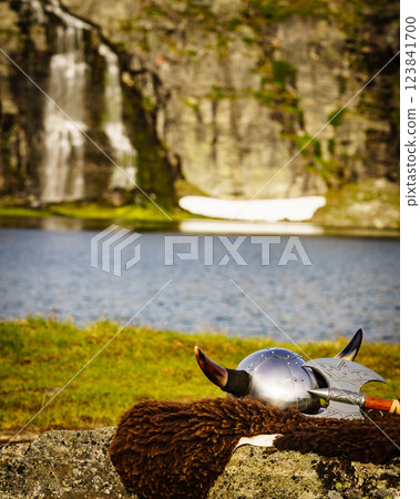 Viking helmet on lake shore, Norway Viking helmet on lake shore, Norway 123841700