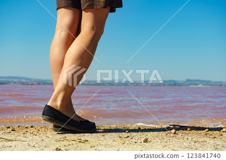 Woman on pink lake in Spain Woman on pink lake in Spain 123841740