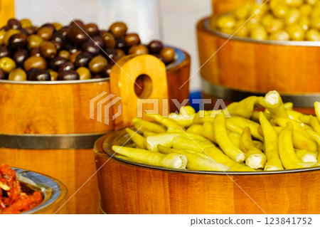 Olives and peppers for sale at market Olives and peppers for sale at market 123841752