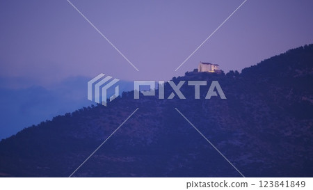Spanish coast landscape with church on hill 123841849