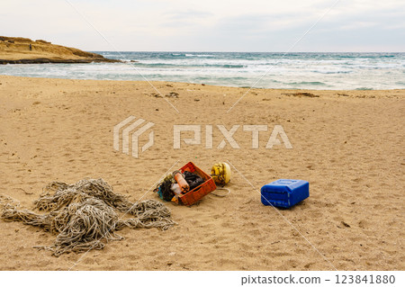 Beach with old fishing rope net. Beach with old fishing rope net. 123841880