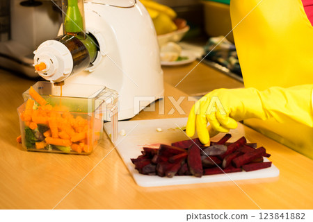 Make vegetables juice in juicer machine 123841882