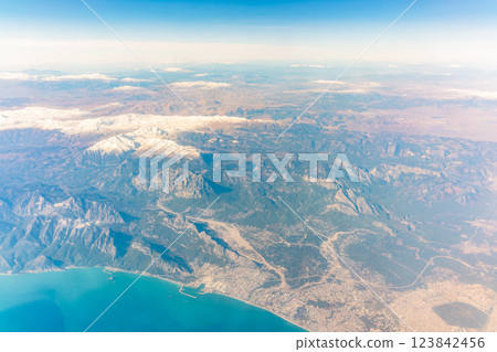 View from the airplane window of the mountains and sea resort with corals in Egypt, Sharm El Sheikh.Flight 123842456