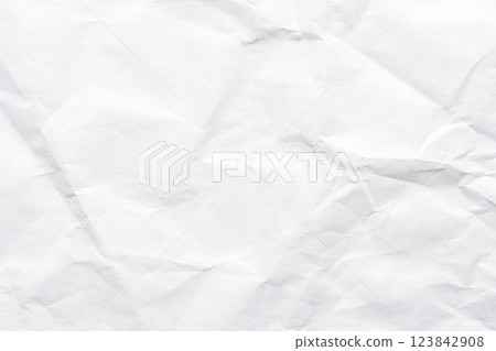 Close-up of white crumpled paper texture with wrinkles and creases 123842908