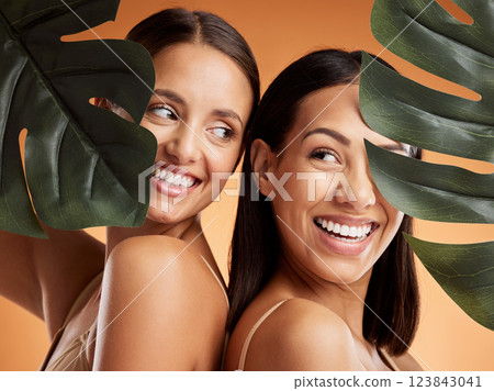 Beauty, skincare and wellness with women and leaf for natural cosmetics, luxury and sustainability together. Health, spa and tropical plant with model in brown background studio for luxury and makeup 123843041
