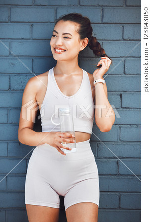 Health, wellness and woman with water bottle for drinking water after exercise, training or workout. Fitness, sports and female from Canada with fresh, refreshing liquid or beverage for hydration. 123843050