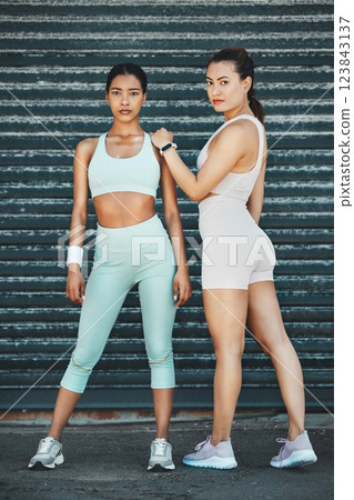 Training, friends and workout with women against an urban background after wellness, health and sport practice. Fitness, runner and portrait of ladies sharing a strong, determined mindset before run 123843137