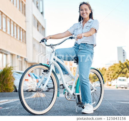 Woman, bicycle and smile for travel in the city, streets of a student relaxing in the outdoors. Portrait of a happy asian female traveling on cycling tour in a urban town on a bike in South Africa Woman, bicycle and smile for travel in the city, streets of a student relaxing in the outdoors. Portrait of a happy asian female traveling on cycling tour in a urban town on a bike in South Africa 123843156