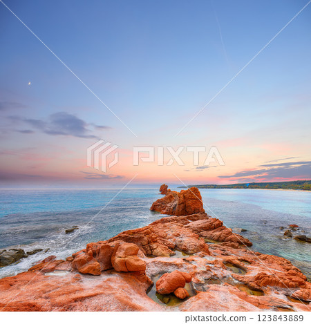 Remarkable sunset view of Red Rocks (is Scoglius Arrubius) on Cea beach Remarkable sunset view of Red Rocks (is Scoglius Arrubius) on Cea beach 123843889