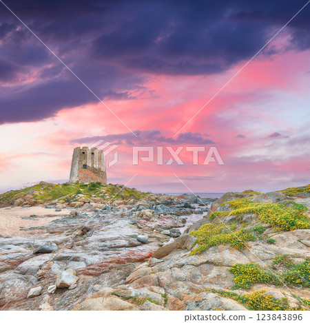 Exciting sunset view of Bari Sardo tower in the Gulf of Orosei. Exciting sunset view of Bari Sardo tower in the Gulf of Orosei. 123843896