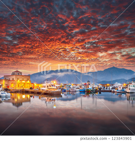 Impressive sunset view on boats in beautiful marina of Villasimius. 123843901