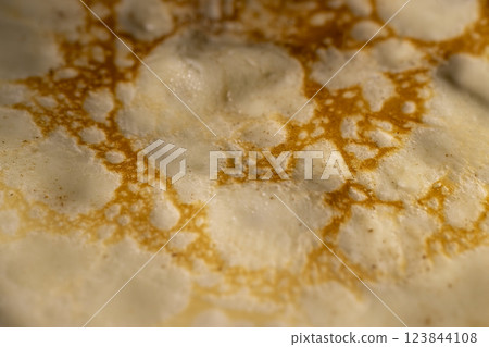 making pancakes from milk and flour with eggs making pancakes from milk and flour with eggs 123844108