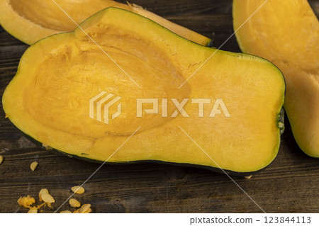 freshly cut orange pumpkin with cooking seeds freshly cut orange pumpkin with cooking seeds 123844113