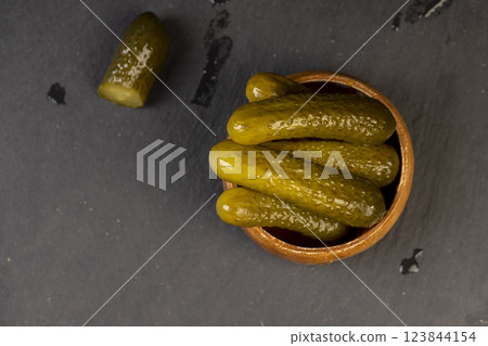 small, crispy green cucumbers salted with spices 123844154
