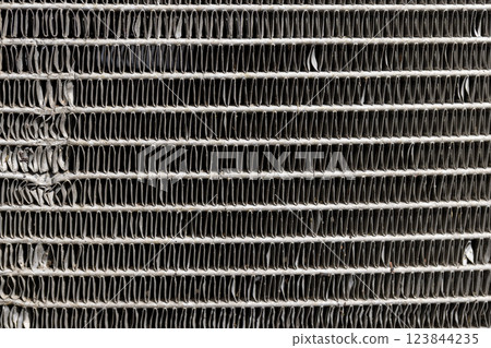 an old car radiator made of lead damaged after an accident an old car radiator made of lead damaged after an accident 123844235