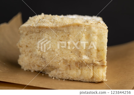 layered cake with white sweet cream on a board 123844256