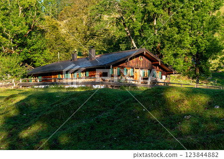 Log cabin remote in the Bavarian Alps on a sunny day in summer Log cabin remote in the Bavarian Alps on a sunny day in summer 123844882