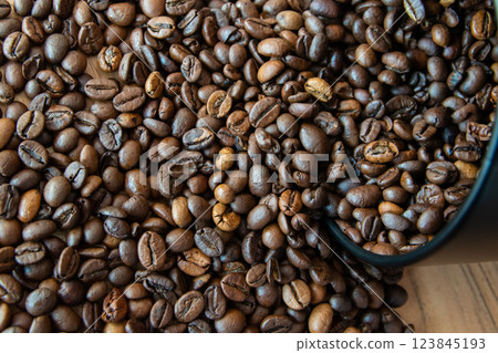 Black box of coffee and roasted coffee beans background. Top view. Black box of coffee and roasted coffee beans background. Top view. 123845193