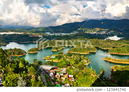 Aerial view of Penol-Guatape Reservoir in Colombia, showcasing its vibrant landscapes lush green hills and a network of shimmering turquoise lakes Aerial view of Penol-Guatape Reservoir in Colombia, showcasing its vibrant landscapes lush green hills and a network of shimmering turquoise lakes 123845740