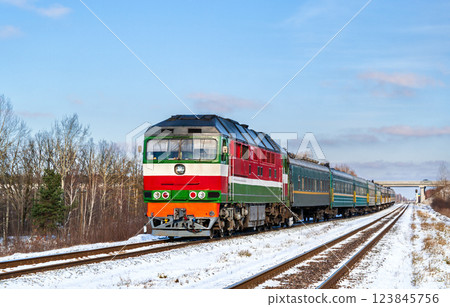 Belarusian locomotive with a Russian passenger train in winter near Korosten, Zhytomyr Oblast of Ukraine Belarusian locomotive with a Russian passenger train in winter near Korosten, Zhytomyr Oblast of Ukraine 123845756