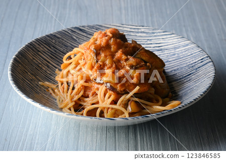 Tomato sauce pasta with eggplant and tuna 123846585