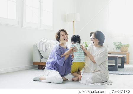 Three generation family in the living room Three generation family in the living room 123847370