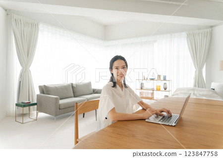 A woman using a computer 123847758