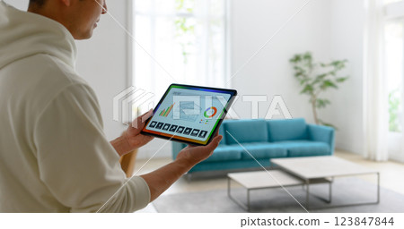 Portrait of a man holding a tablet 123847844