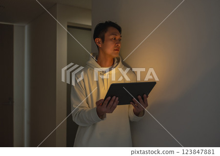 Portrait of a man with a tablet 123847881
