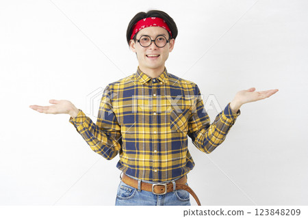 Akihabara-style man pointing left and right with palms on white background Akihabara-style man pointing left and right with palms on white background 123848209