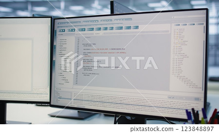 Computers in data center hosting rackmount ensuring faultless operations conditions. Close up of PC monitors on desk used for monitoring data center devices energy consumption Computers in data center hosting rackmount ensuring faultless operations conditions. Close up of PC monitors on desk used for monitoring data center devices energy consumption 123848897
