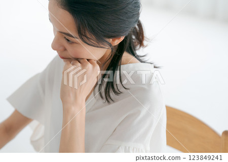 A woman suffering from a headache 123849241