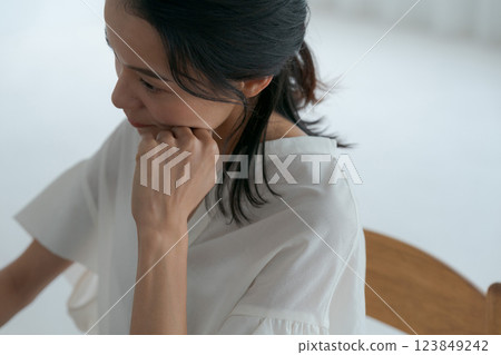 A woman suffering from a headache 123849242